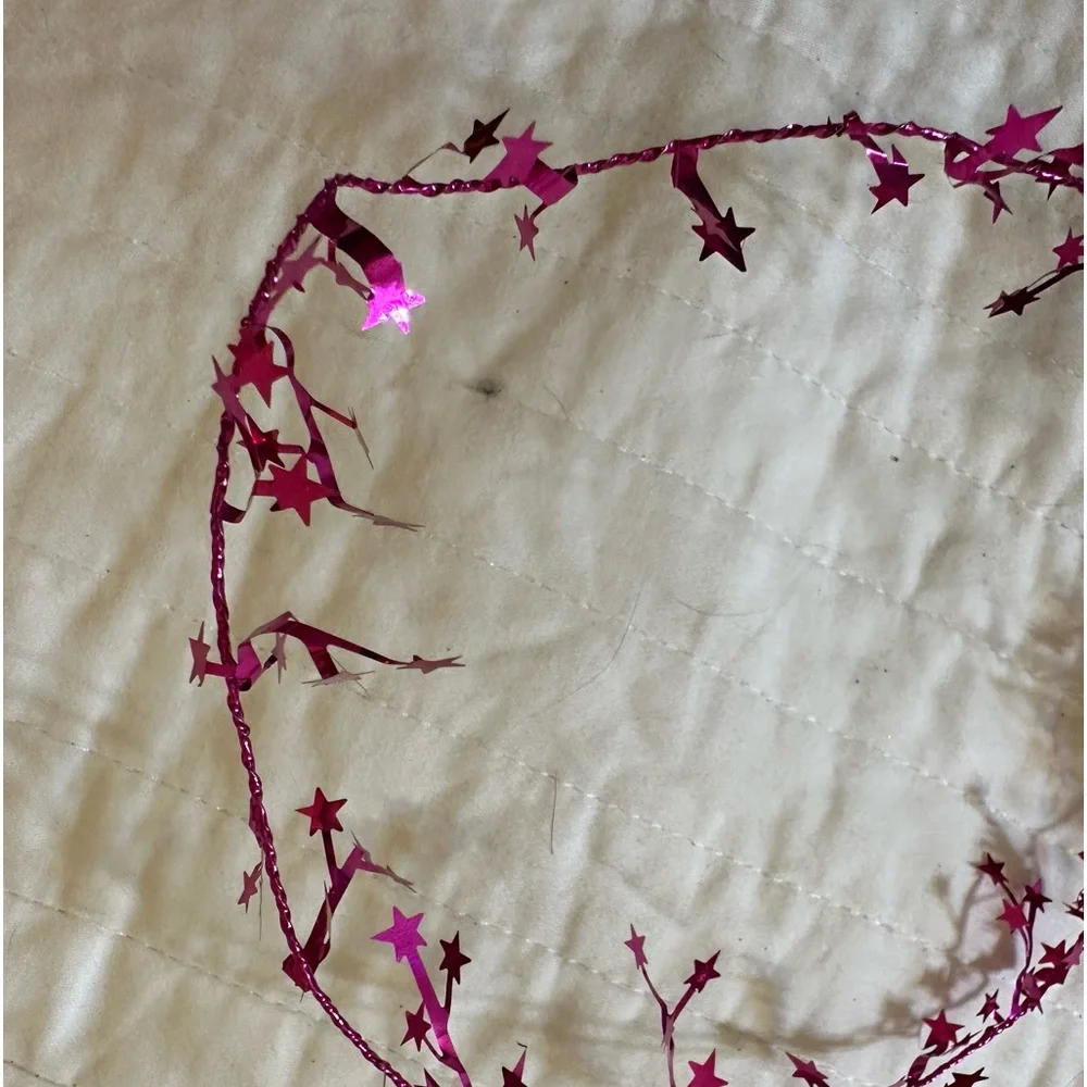 2 bundles of wired pink shimmery star garland - each about 25 feet long